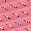 Repeat pattern of digital electronic thermometer on red Royalty Free Stock Photo