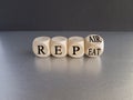 Repeat and repair symbol. Businessman turns a wooden cube and changes the word repeat to rep