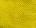 Repeated Diamond Pattern on Bright Yellow Rubber Textile. Use as Background. Royalty Free Stock Photo