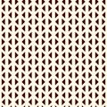 Repeated mini triangles on white background. Simple abstract wallpaper. Seamless pattern design with geometric figures. Royalty Free Stock Photo