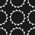 Repeated round elements from the silhouettes of cats. Seamless pattern.