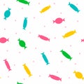 Repeated silhouettes of candy in wrapper and scattered polka dot. Cute seamless pattern for kids.