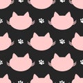 Repeated silhouettes of cat heads and paw prints. Cute seamless pattern. Royalty Free Stock Photo