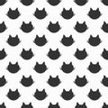 Repeated silhouettes of cat`s heads. Cute seamless pattern.