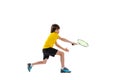 Dynamic portrait of teen, sportive kid playing tennis isolated over white studio background. Concept of sport Royalty Free Stock Photo