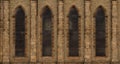 Repeating facade of stone-brick church in England with arched wi Royalty Free Stock Photo