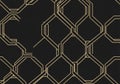 A repeating geometric pattern consisting of interlocking hexagons outlined in gold against a black Royalty Free Stock Photo
