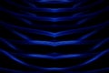 Dark abstract background of neon blue lines