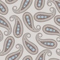 Repeating Paisley pattern in blue and light brown. Eastern-inspired motif.
