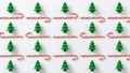 Repeating Pattern of Green Christmas Trees and Red Candy Canes on White Royalty Free Stock Photo