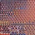 A repeating pattern of hexagons in shades of pink and orange, forming a honeycomb design2, Generative AI