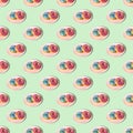 Repeating pattern from a plate of donuts on a green background Royalty Free Stock Photo