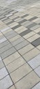 Repeating pattern of rectangular gray pavers creating a geometric, textured floor surface Royalty Free Stock Photo