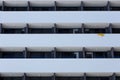 Repeating pattern of windows and balcony. Building front