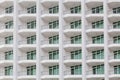 Repeating pattern of windows and balcony. Bulding front Royalty Free Stock Photo