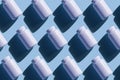 Repeating white cans of pills on a blue background