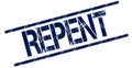 REPENT blue distressed rubber stamp.