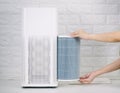 Replace the air purifier filter the house Royalty Free Stock Photo