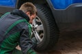 Replace summer tires against winter tires Royalty Free Stock Photo