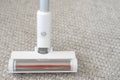 Replaceable brush of vacuum cleaner against the carpet Royalty Free Stock Photo