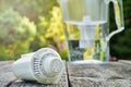 Replaceable cartridge and a water filter jug on the wooden boards in the summer garden Royalty Free Stock Photo