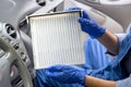 Replacement of cabin pollen air filter for a car. Basic auto mechanic skills concept. Royalty Free Stock Photo