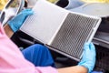 Replacement of cabin pollen air filter for a car. Basic auto mechanic skills concept. Royalty Free Stock Photo