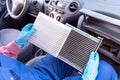 Replacement of cabin pollen air filter for a car. Basic auto mechanic skills concept. Royalty Free Stock Photo