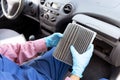 Replacement of dirty cabin pollen air filter for a car Royalty Free Stock Photo