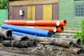 Replacement of water supply and sewer pipes, dirty old pipes next to new modern plastic pipes