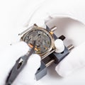 Replacing battery in quartz wristwatch close up