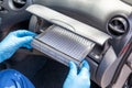 Replacing cabin pollen air filter for a car Royalty Free Stock Photo