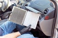 Replacing the dirty cabin pollen air filter for a car Royalty Free Stock Photo