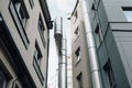 replacing downpipes in the street with view to the high-rise buildings Royalty Free Stock Photo