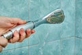 Replacing old cracked shower head in bathroom Royalty Free Stock Photo