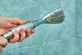 Replacing old cracked shower head in bathroom