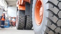 Replacing tires on mining dump car in a garage during maintenance service Royalty Free Stock Photo