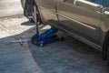 Replacing a wheel on a car. Car lifted on a jack for wheel repair