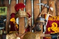 Replica of the ancient Roman helmet of a soldier of a legionary against the background of a log wall of a weapons warehouse Royalty Free Stock Photo