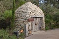 A replica of a Borrie or ox stable in a biome in the Eden Project in Cornwall, England