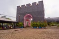 Jambi, Indonesia - September 2019. an replica of fortress building with a pink of flower gate in jambi