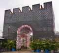 Jambi, Indonesia - September 2019. an replica of fortress building with a pink of flower gate in jambi