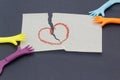 Replica of hand pulling paper with love symbol. Royalty Free Stock Photo