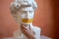 Replica head statue antique statue David, mouth is sealed with yellow tape