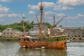 A replica of John Cabot\'s ship Matthew in Bristol Docks, in the background Cabot Tower, Bristol, United Kingdom