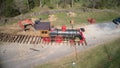 Replica of an Old 1860`s Steam Engine Being Assembled onto the Tracks Ready