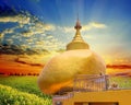 The replica of Phra That In-Kwaen Hanging Golden Rock with Sunset background, Sirey temple, Phuket, Thailand.