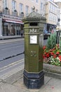 Green Penfold pillar box in Windsor on the corner of High Street and Church Lane Royalty Free Stock Photo
