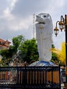 Replica of Singapore white lion statue, in the city park of Madiun Indonesia with clear blue sky