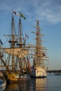 Replicas of Tall Ships in the Setting Sun